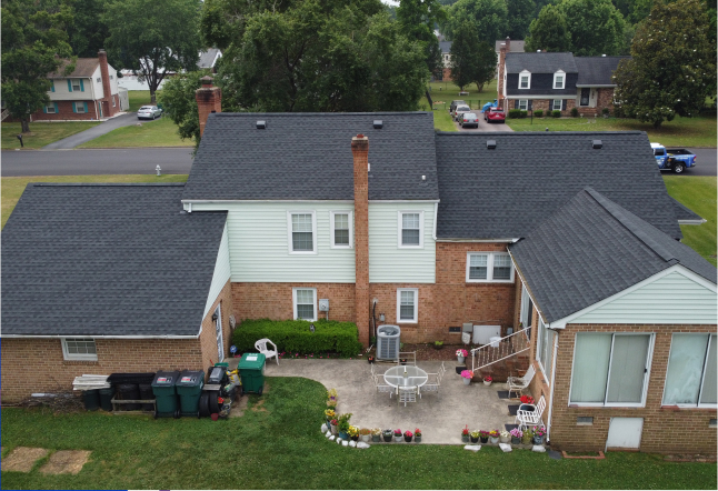 Dark asphalt shingle home