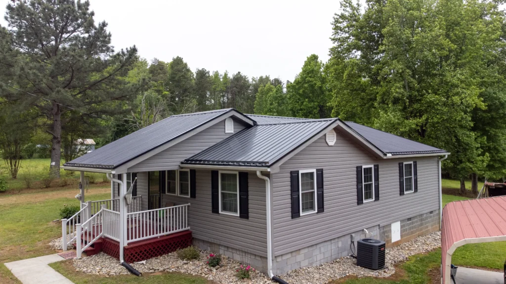 Dark metal roof and grey siding