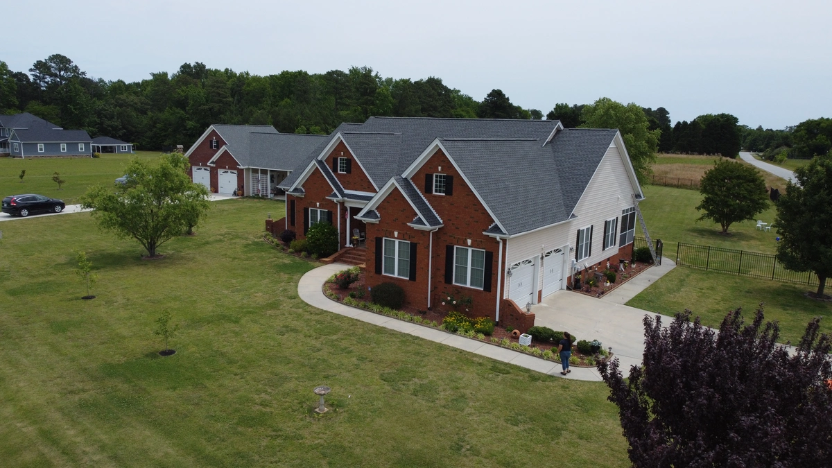 red brick home with gray roof