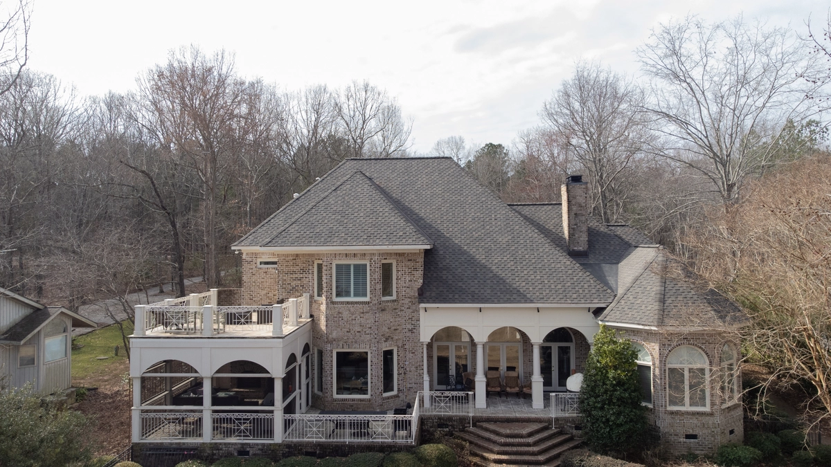brick luxury home by water