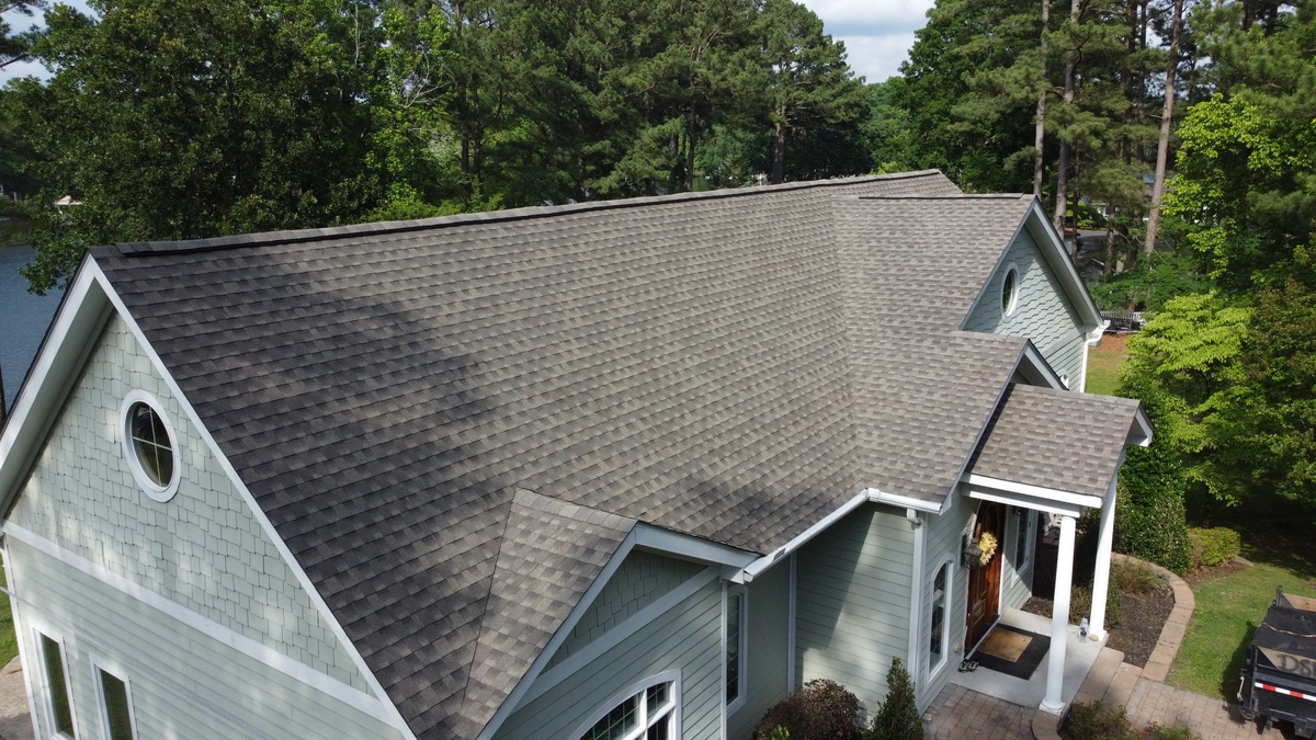 soft green siding on the large house