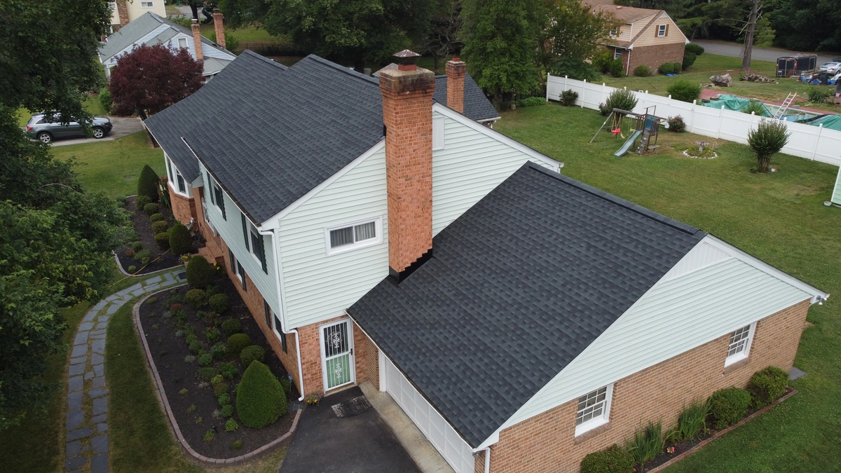 half brick half vinyl siding on the house