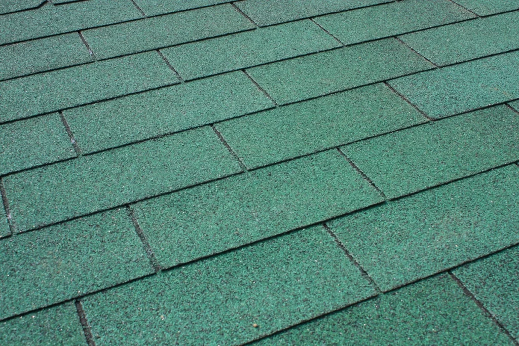 close up to green asphalt shingles
