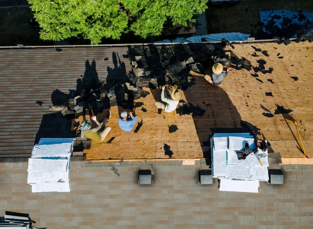 roofing crew removing shingles