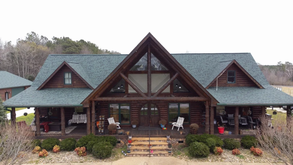 Wooden cabin house with new green gutters