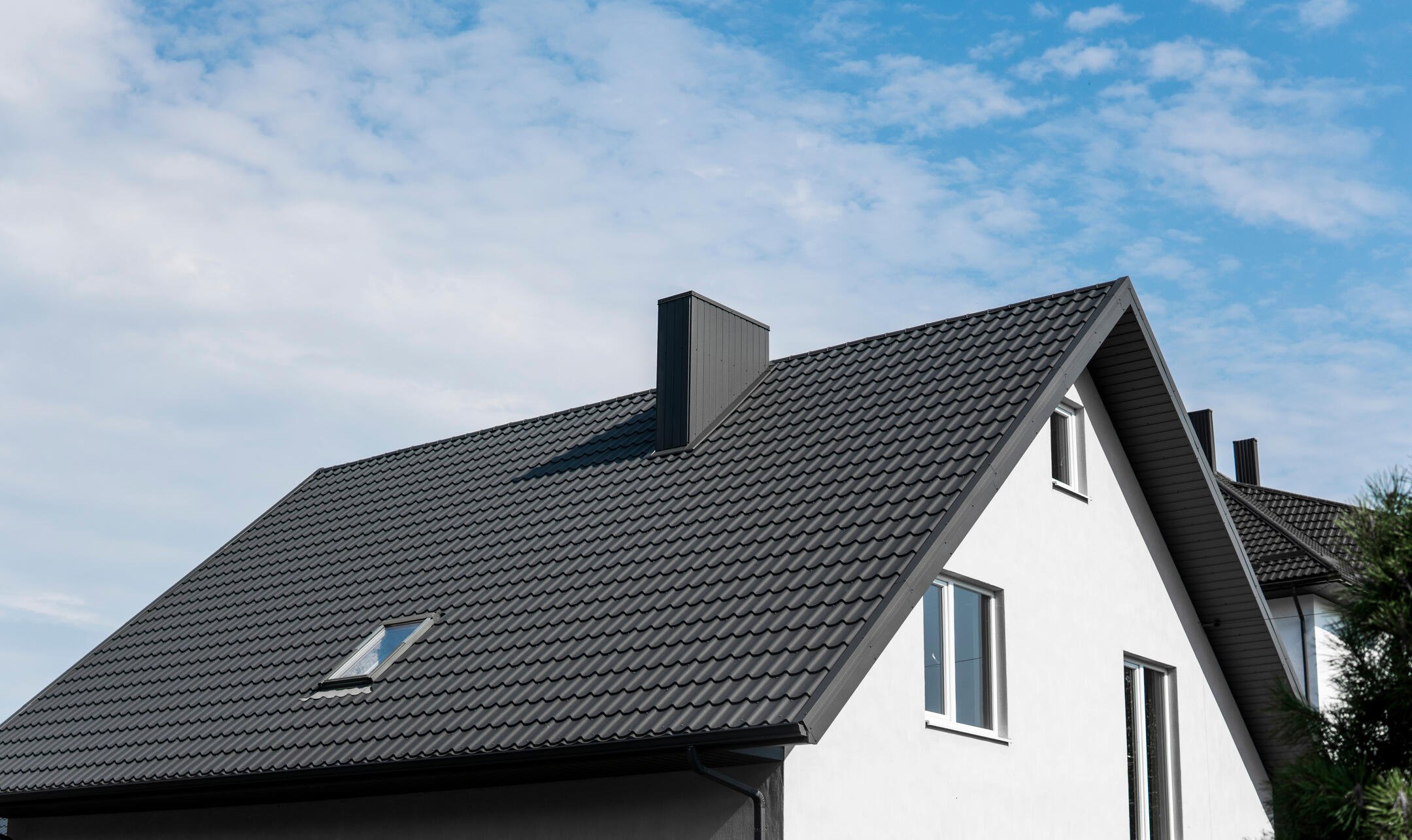 roofing chase city va-white house with black metal shingles