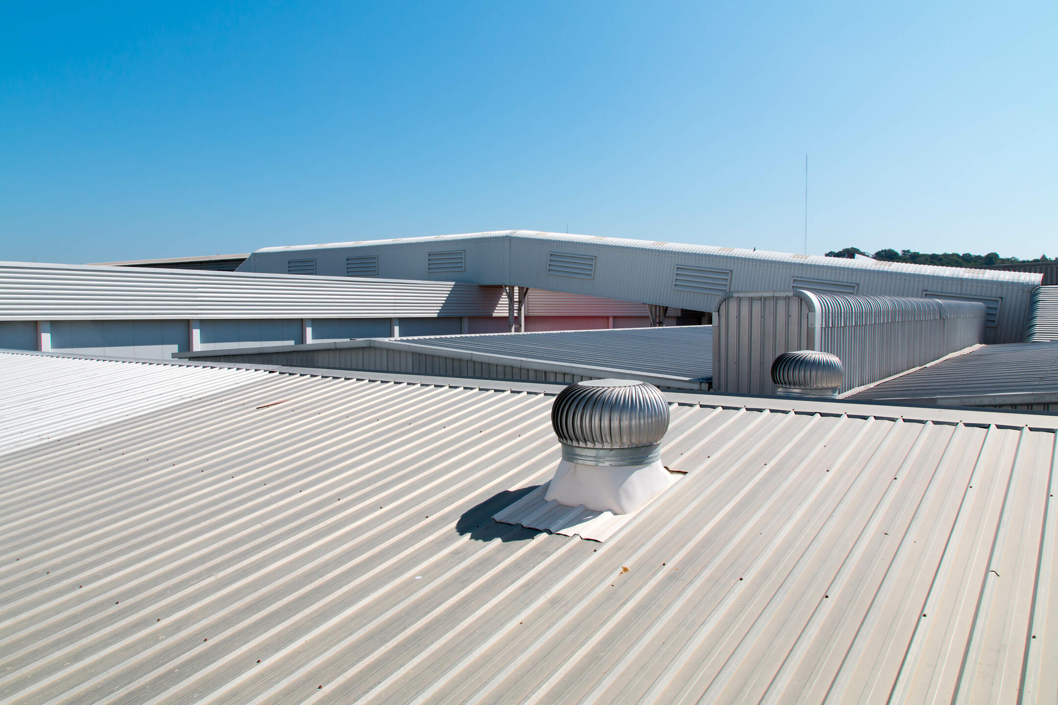 commercial roofing henderson nc-close up of metal roof with commercial vents