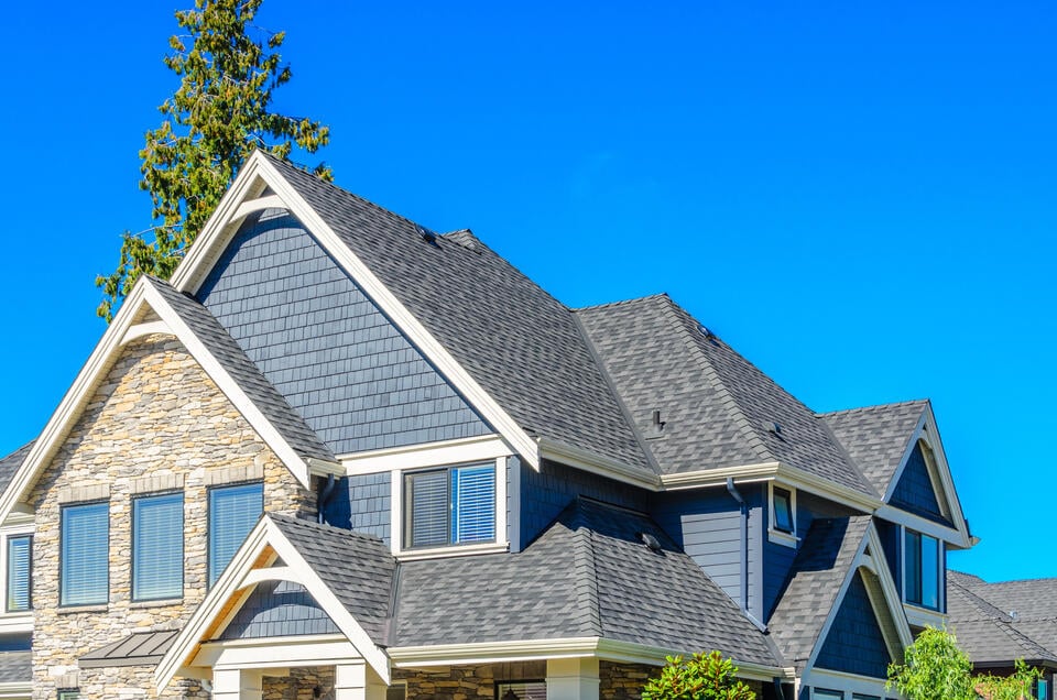 best roof sealant for asphalt shingles-stone and blue sided house with gray shingles