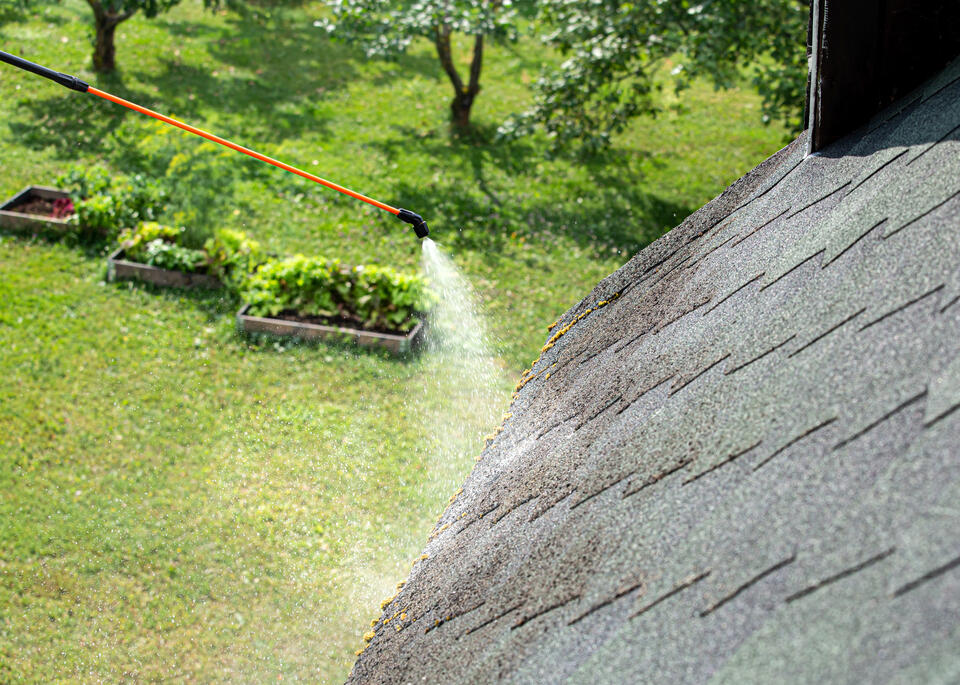 how to get moss off a roof-roof shingles being washed with power washer