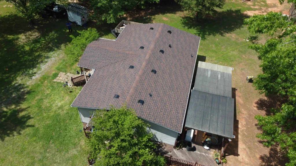 downward aerial view of new roof installation with brown architectural shingles in blackstone va