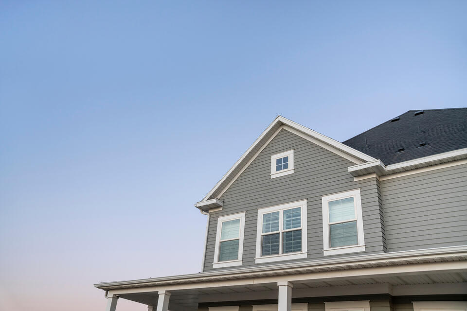 siding contractors blackstone va-gray vinyl siding on house with white trim and details