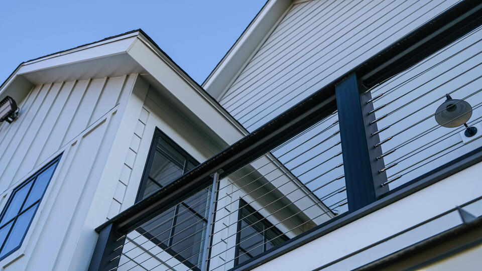 siding contractors henderson nc-close up white siding on house with black trim and details