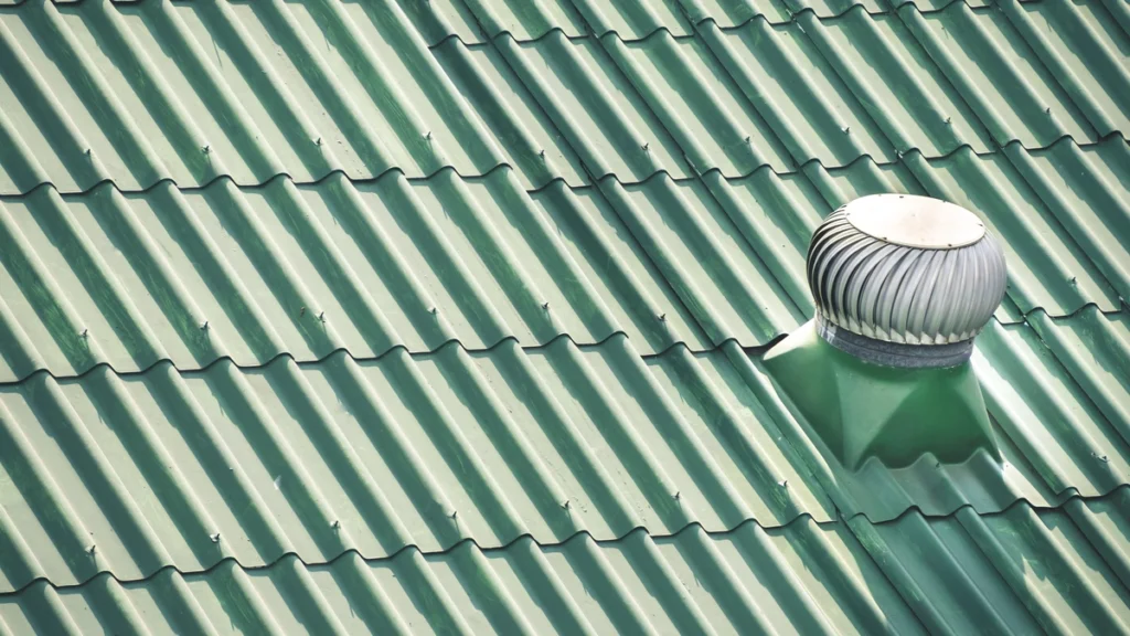 green metal roof with vent