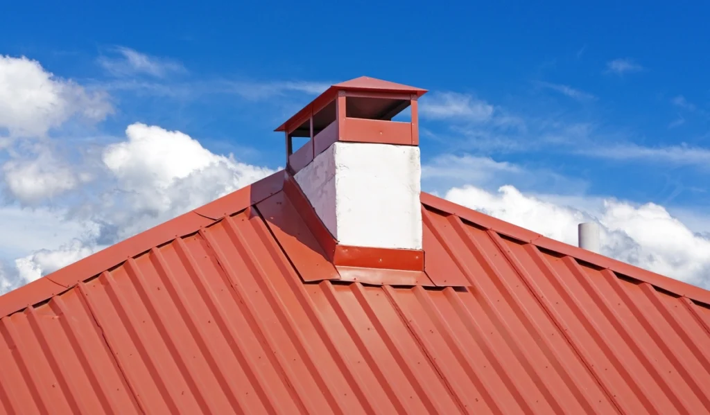 Red metal roof chimney flashing