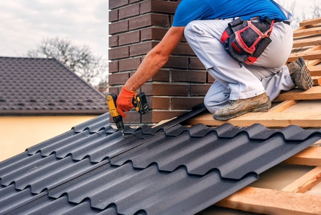 roofer installing metal roof chase city va