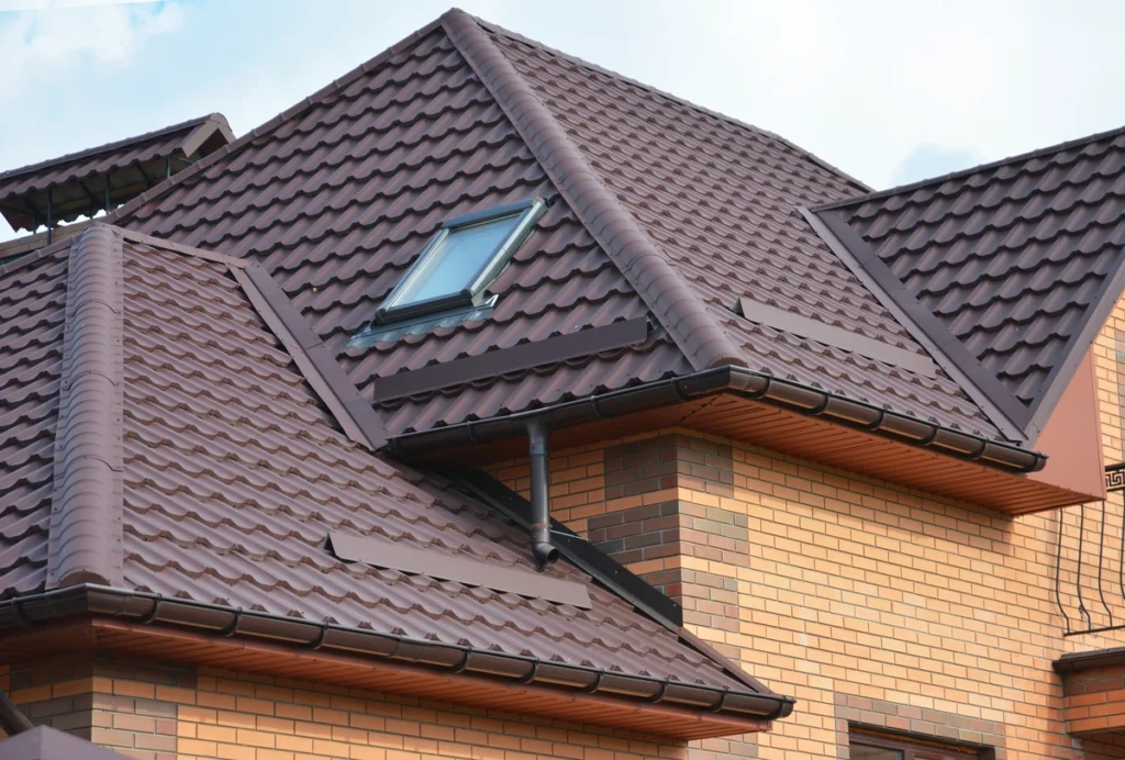 house with maroon metal roof