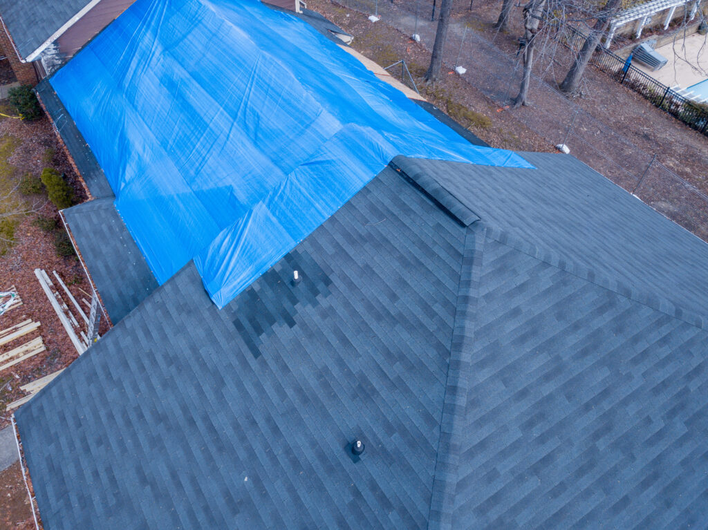 Fire damaged apartment building how to tarp a roof