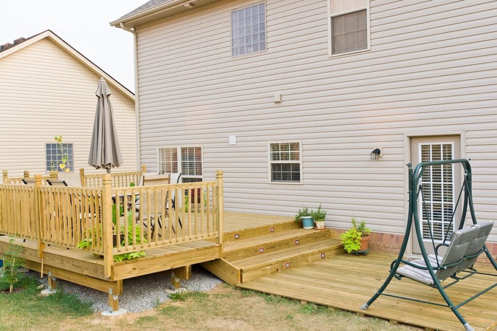 New above ground deck and patio of family home.