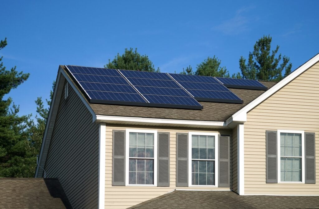 sustainable roofing options solar panel installed on the house roof