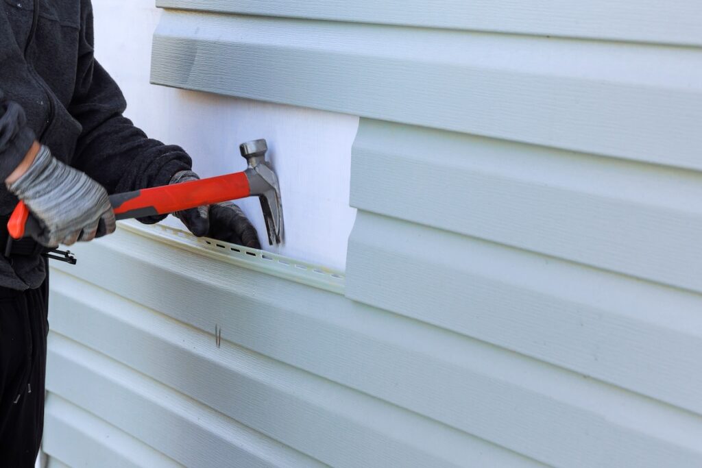 Reconstruction of exterior of house includes replacement of damaged plastic siding how to remove vinyl siding