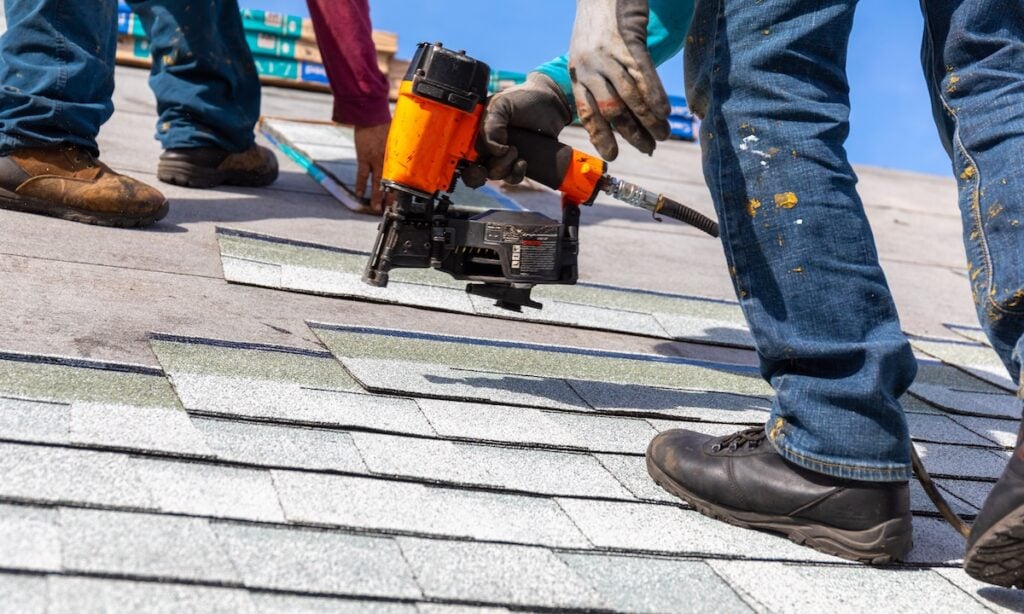 what are starter shingles roofer installing roof shingles with pnuematic roofing nailer.
