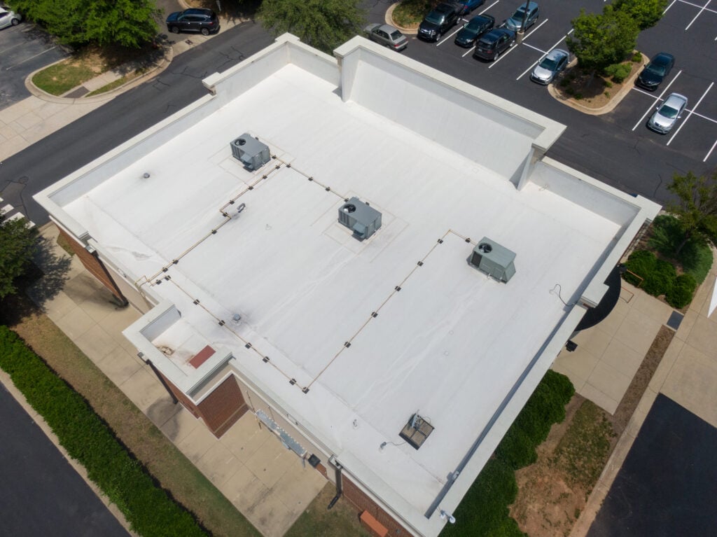 Drone Images of Commercial Roofs Featuring TPO and Asphalt Shingles: Midday, Sunny, No People