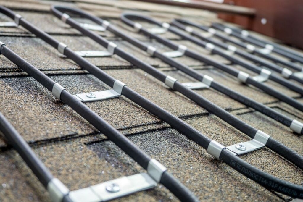 Heating cable on roof of building