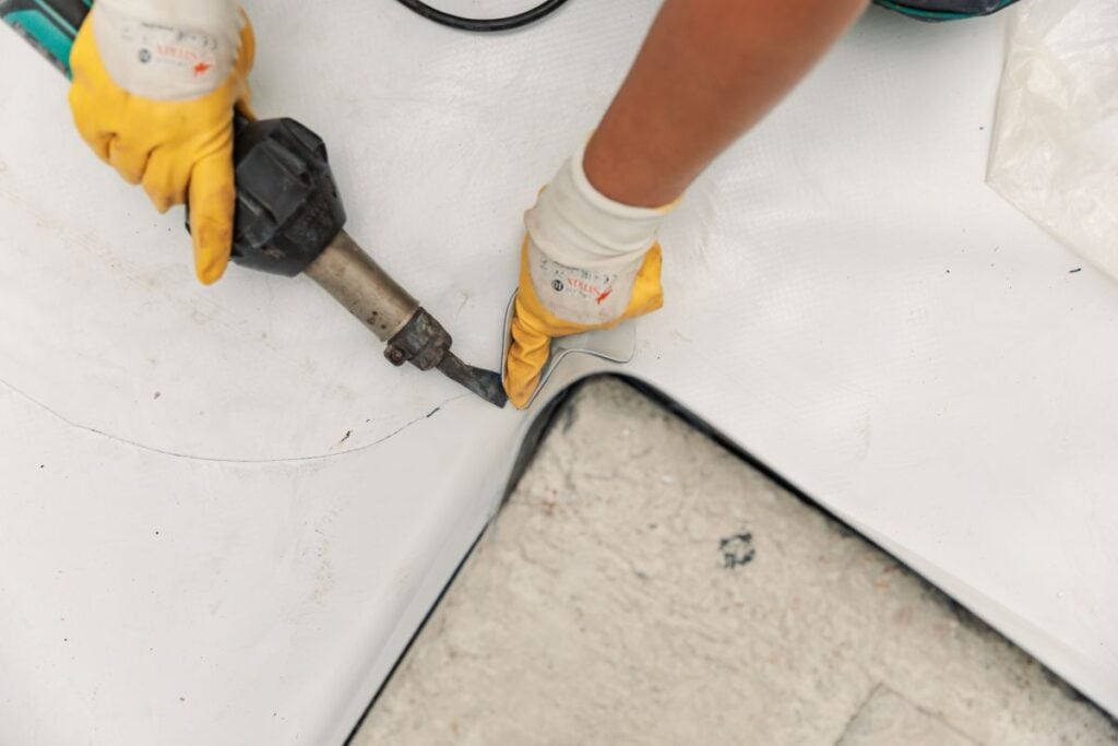 flat roof commercial building TPO installing