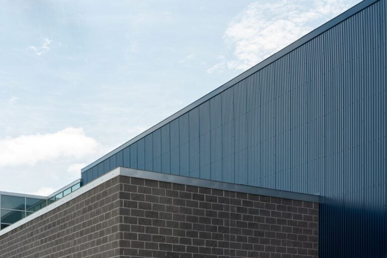 silver metallic flat roof flashing big building