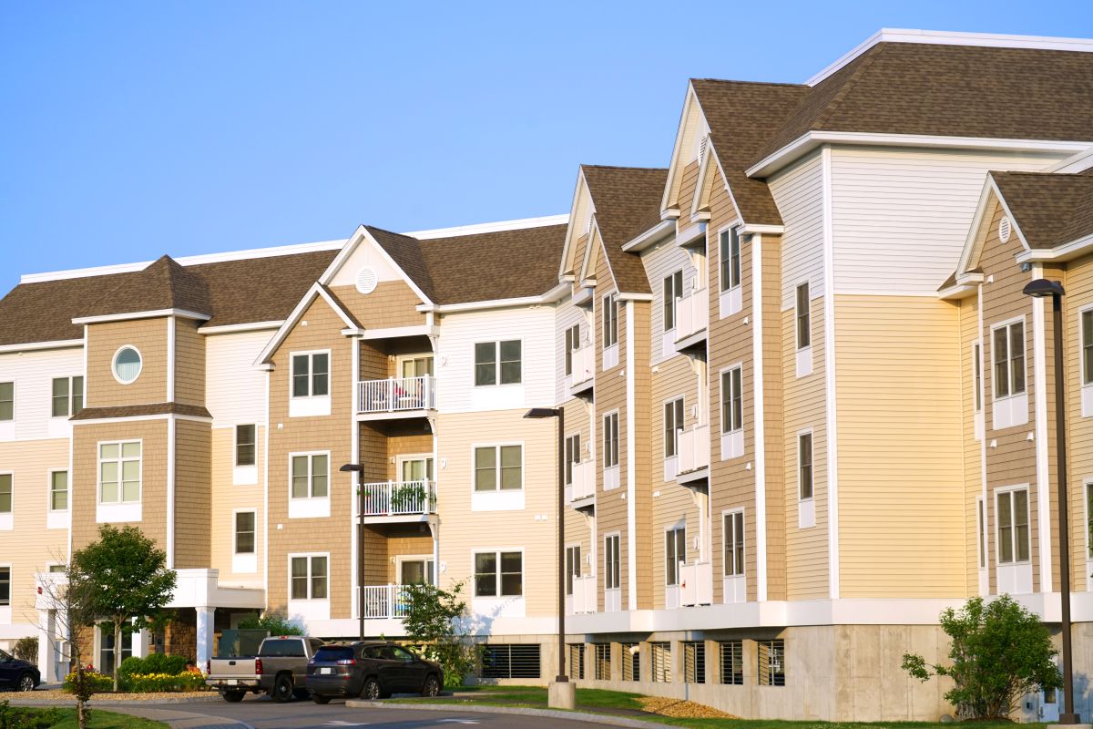 apartment buildings with brown shingle roofs