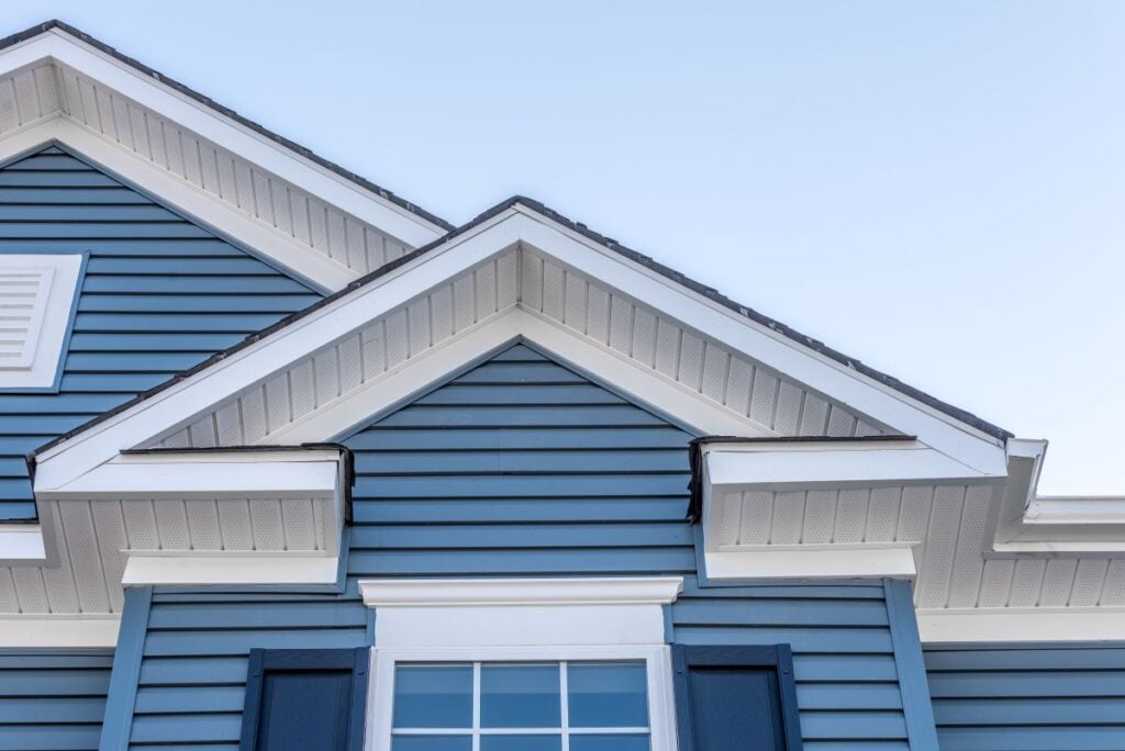 blue siding on a big house